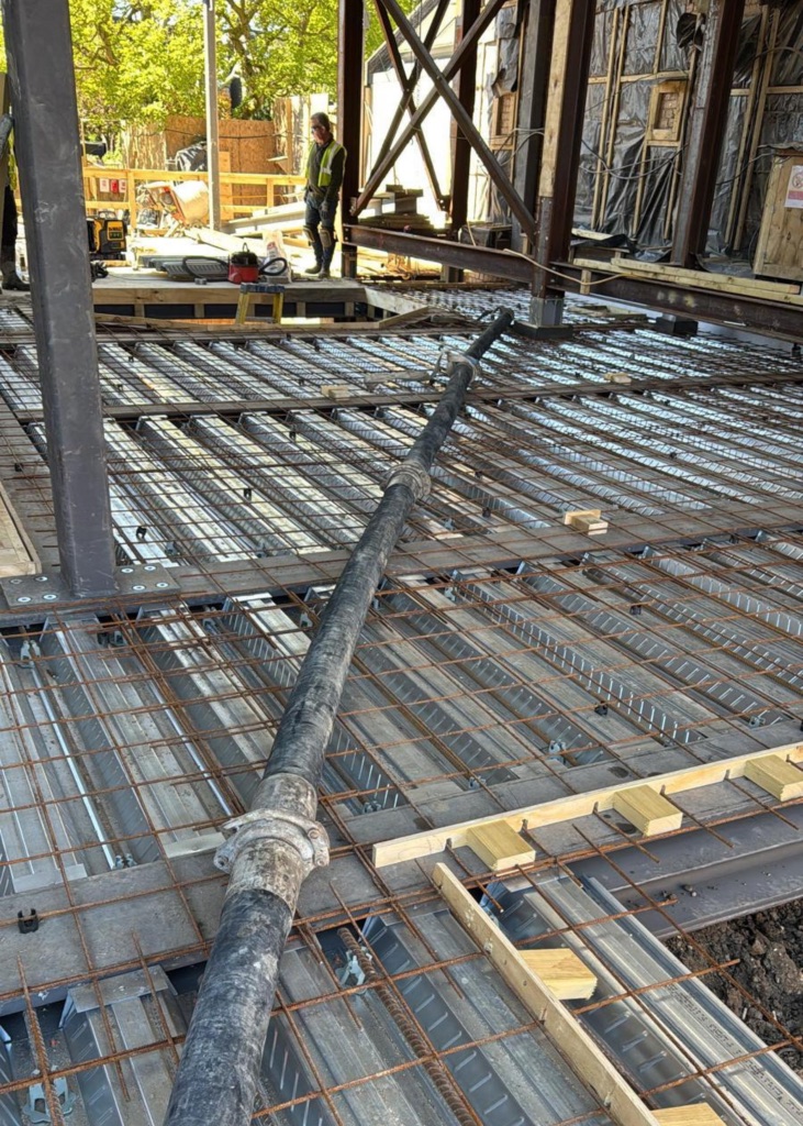 A King Concrete Pumping line pump feeding concrete on site near Coulsdon